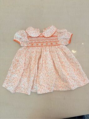 Smocked Baby Dress in White with Coral Floral Print